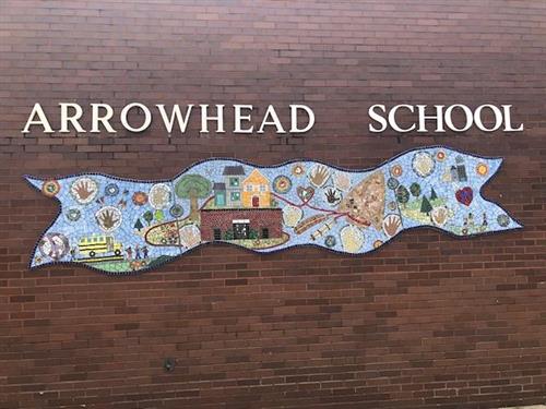 arrowhead school mosaic on building facade 
